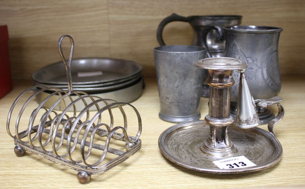 A Victorian silver plated chamberstick, pewter tankards, plates and a toast rack
